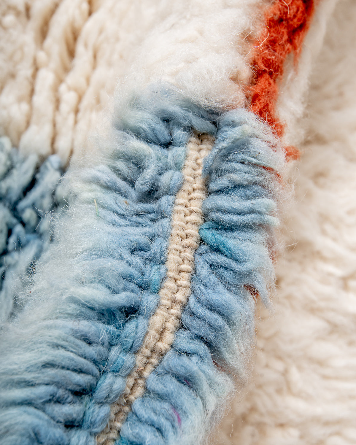Modern, designer, handcrafted Berber rug from Morocco. Beniourain carpet with beautiful colours and patterns and fluffy wool texture.